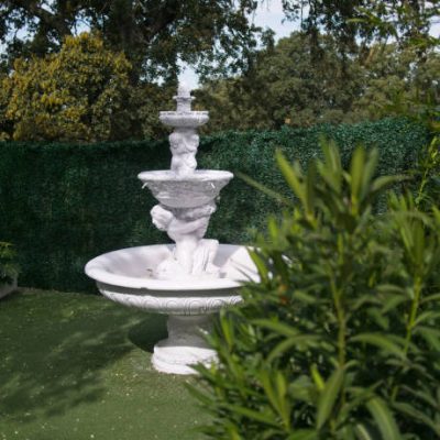 White fountain in the garden.